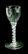 Old English wine glass with ogee bowl, pair of spiral tapes raised on a circular foot, height 13.5cm