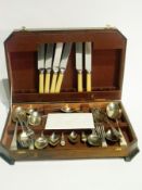 Horn handled carving set (boxed), a large quantity of silver plate flatware, a wooden canteen with