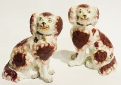 Pair of small Staffordshire spaniels, 18cm high and a model of a dalmation on grassy base, 17cm high