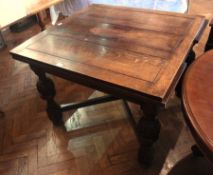 Oak draw-leaf dining table with carved bulbous supports, block feet