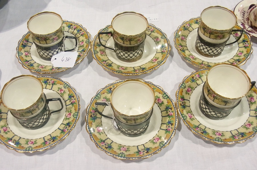 Set of six early 20th century Aynsley china silver-mounted coffee cans and saucers with floral