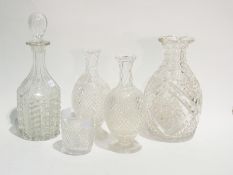 Cut glass tall neck decanter with stopper, another decanter of baluster form and a pair of cut