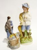 Staffordshire flatback model of a man wearing plumed hat, carrying sheath of corn, 35cm high and a