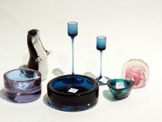 Two Wedgwood blue glass candlesticks, Wedgwood glass otter, Caithness paperweight and three blue