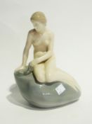 Royal Copenhagen porcelain model of a mermaid on rock, 23cm high