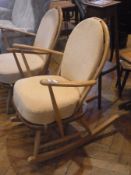 Pair Ercol lightwood spindle back rocking open armchairs