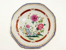 Set of nine antique Chinese octagonal famille rose plates painted with flowering branches, rust