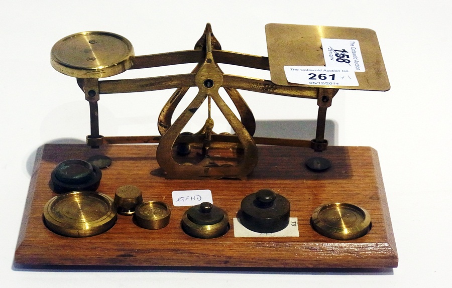 Set of bass and mahogany postal scales