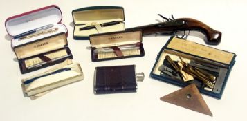 A quantity of collectables to include replica pistol, fountain pens, geometry set, hip flask,