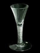 Old English wine glass with trumpet bowl, multiple air-twist stem, raised on a large circular