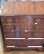 Reproduction figured mahogany bureau with four long drawers