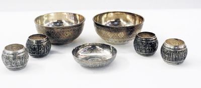 Two Persian silver-clad bowls, four napk