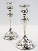 Pair of silver candlesticks with a slend