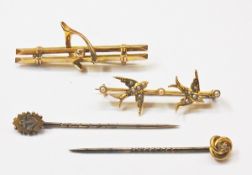 Gold-coloured bar brooch in the form of