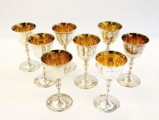 Set of eight parcel-gilt silver wine gob