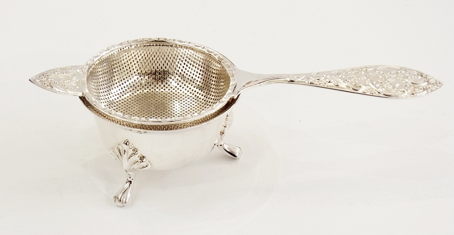 Silver tea strainer and stand, the strai