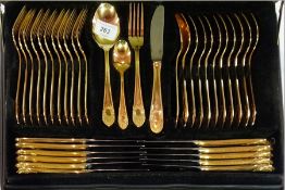 A SPS German gold-plated canteen flatware, in faux leather suitcase, for eleven persons