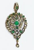 Gold coloured metal emerald and pearl pendant, pierced, shaped circular pendant, set central