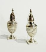 Pair Victorian silver pepper pots, with bead borders and reeded spiral body, raised on a square