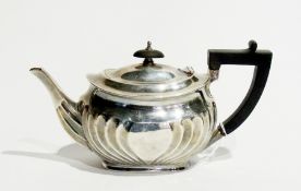A Victorian silver bachelor's teapot, with ebony finial and handle, of oval form with fluting,