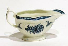 18th century Worcester porcelain sauceboat, shaped oval and embossed, underglaze blue decoration