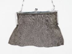 A continental white metal chainlink evening bag, with clasp set with cabochon stones and a chainlink