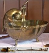 A quantity of brass fire tools to include:- brass coal scuttle in the shape of a shell, a flower
