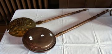 A copper warming pan together with a brass warming pan (2)