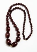 Red amber-type bead necklace of oval graduated beads