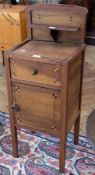 A hardwood pot cupboard, with inlaid decoration, on square supports, 35cm wide approximately