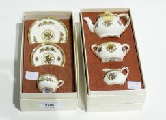 Boxed set of china miniatures, viz:- teapot, two-handled sugar bowl and cream jug, "Ming Rose"