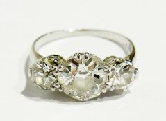 Three stone diamond ring, each stone circular, the central stone 1.5ct approx, flanked by two