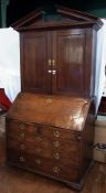 Early George III oak and mahogany bureau cabinet with broken triangular pediment, quadrant frieze,