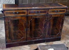 A modern mahogany sideboard, with three drawers above three cupboards, with brass swan-neck handles,