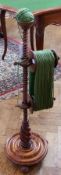 A  19th century mahogany turned wool winder, with reeded column, on circular base on bun feet,