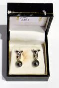 Pair white metal, black pearl and diamond drop earrings