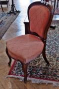 A Victorian mahogany bedroom chair, with padded back and seat on cabriole supports
