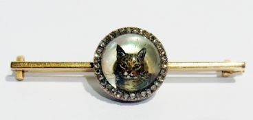 Victorian gold coloured metal reverse crystal intaglio and diamond cat brooch, the circular intaglio