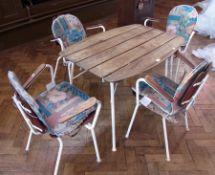 A mid 20th century garden table and chairs, rectangular shaped slatted top, on white cast iron