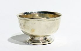 A George V silver sugar bowl, with reeded border, on a raised circular foot, London 1922, diameter