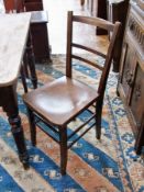 Set of four stained pine kitchen chairs, with relief floral decoration to wooden seat (4)