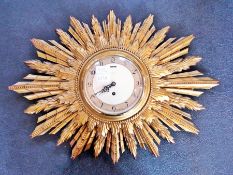 A 1950's Smiths gilt sunburst clock, eight day