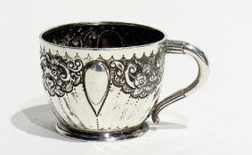 A Victorian silver christening cup, with foliate and C-scroll repousse decoration on a fluted