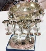 An EPNS punch bowl with classic cups, bowl, ornate foliate engraved with lion mask handles, five
