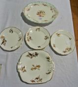 China sandwich set, viz:- bread and butter plate and six teaplates, all painted with exotic birds in