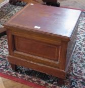 A mahogany commode, with satinwood banding to hinged lid, on tapering supports, 49cm wide