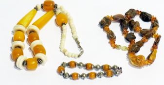 Rough polished dark and yellow amber coloured bead and bone necklace and yellow amber coloured