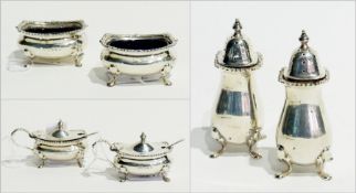 Two sets of George V silver cruets, salts, peppers and mustard pots (6)
