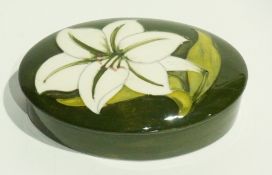 Moorcroft pottery "Bermuda Lily" patterned trinket box and cover, oval, green ground, impressed mark