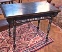 A Victorian ebonised card table, with carved and pierced decoration on turned supports, 91cm wide